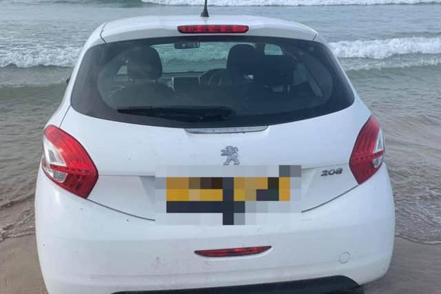 The white Peugeot 208 on Portstewart Strand on Monday. (Photos: Cop/Vosa Watch Derry)