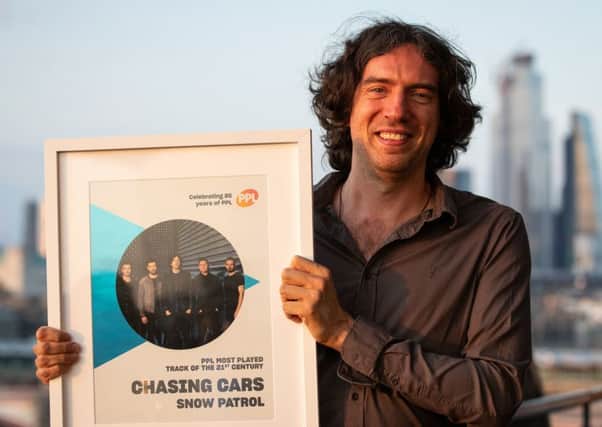 Gary Lightbody with the award for Most Played Song of the 21st century