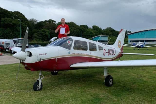 Air Cadet Mark Woods celebrates his private pilot's licence.