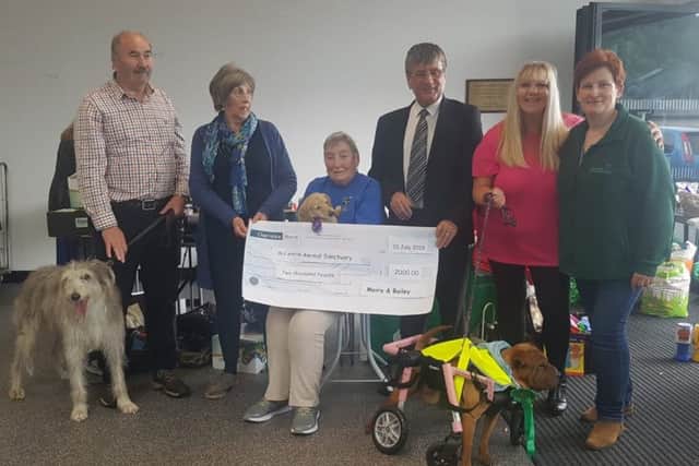 A cheque for £2,000 was presented to Mid Antrim Animal Sanctuary by fundraiser Moira Hutchinson who is a stall holder at Larne Market.