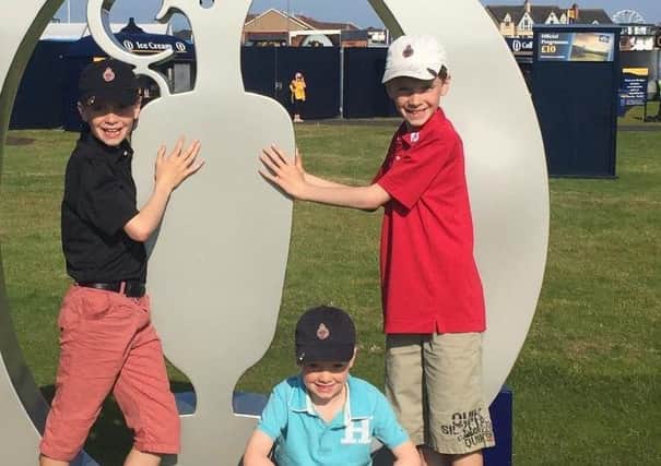 Ben McAvoy (red shirt) with his twin Thomas and younger brother Jonny at the Open championship at Royal Portrush