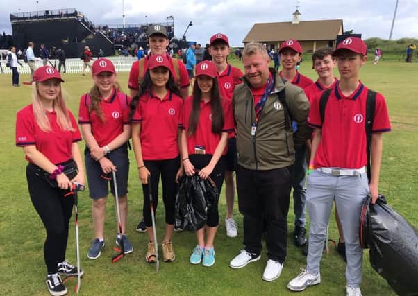 Royal Portrush member Richard Beggs with some of the young people who are helping to keep the Dunluce Links litter-free during The Open