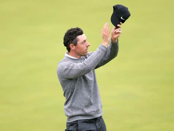 Rory McIlroy appears dejected after the 18th green. David Davies/PA