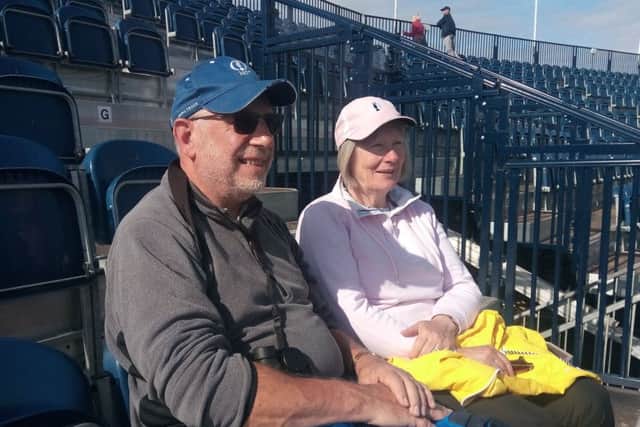 Mike Hoxley and Susan from Norfolk in the stand at the 18th hole at Royal Portrush, which they got to early on Friday July 19 2019. Mike, who has now been to all 10 Open venues, said the infrastructure at Portrush was "as good as anywhere". Pic Ben Lowry