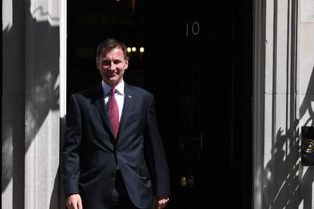 Foreign Secretary Jeremy Hunt leaves after a cabinet meeting at 10 Downing Street, London on Tuesday, ahead of the announcement of the new Tory leader. Photo: Victoria Jones/PA Wire