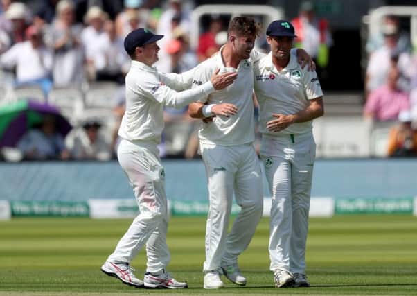 Ireland's Mark Adair celebrates with his team mates after England's Joe Denly gets out by lbw.