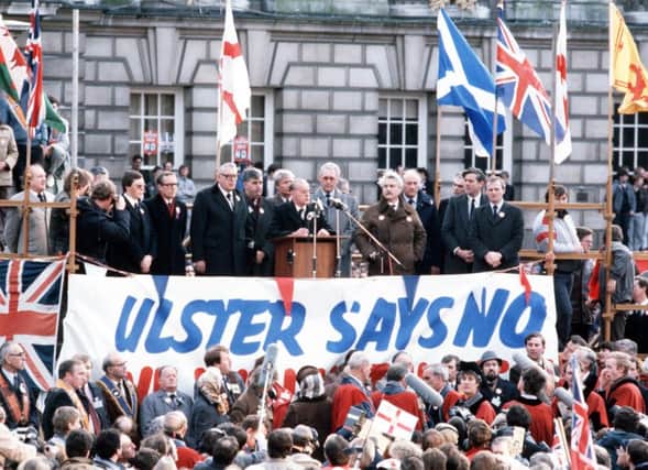 Unionist MPs resigned over the 1985 Anglo-Irish Agreement, above, and should do so over imposition of abortion laws