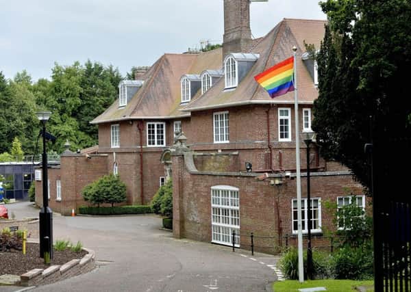The LGBT rainbow flag flying outside Stormont House in Belfast in 2017 to mark gay Pride week. Inside Stormont House is where royal pictures are believed to have been removed after a complaint. Julian Smith could reinstate them