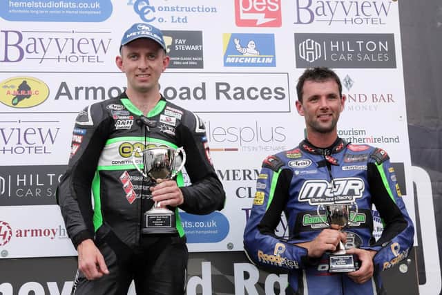 Derek McGee on the Supersport podium with Michael Sweeney, who finished third. Runner-up Paul Jordan did not take his place on the rostrum. Picture: Stephen Davison/Pacemaker Press.