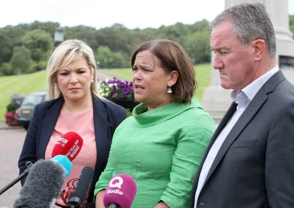 Mary Lou McDonald (centre) with Michelle ONeill and Conor Murphy at Stormont on Friday