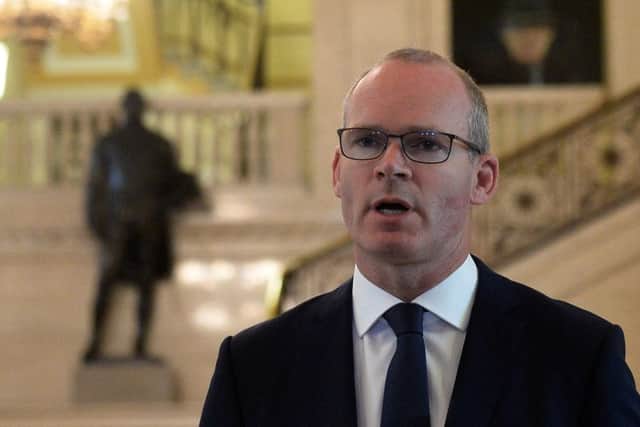 Simon Coveney speaking to the media at Stormont on Friday
