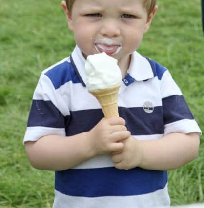 Two-year-old James Richardson from Annaghmore enjoys an ice cream at Antrim Show