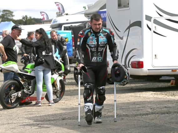 Michael Dunlop hobbled around the paddock at Armoy on crutches, but it didn't stop him winning both Superbike races on the Tyco BMW. Picture: Stephen Davison/Pacemaker Press.