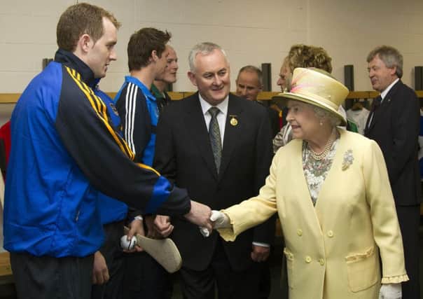 Queen Elizabeth II and GAA President Christy Cooney (centre) meet players during a tour of Croke Park, Dublin, during the second day of her State Visit to the Republic of Ireland in 2011. Photo: PA Wire/PA Wire