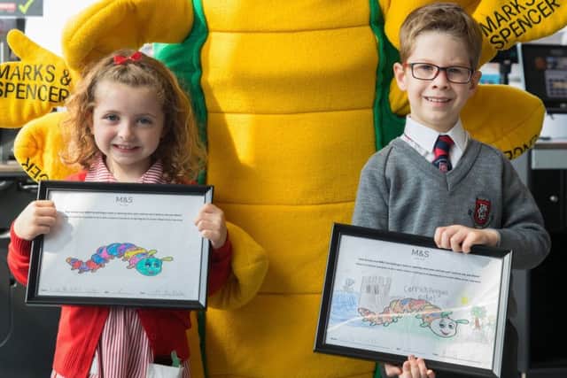 Eva Morrison (5) and Oscar Millar (6) from Model Primary School officially opened  the new M&S store in Carrickfergus.