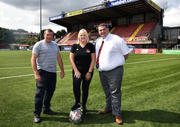 Workers behind the scenes at Crusaders FC home ground Seaview (from left) John Flack, Gillian Hardy and David Arthurs