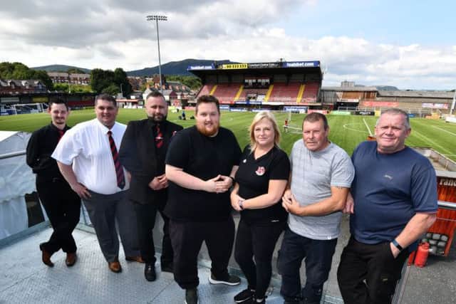 Workers behind the scenes at Seaview where Crusaders are taking on Wolverhampton Wanderers of the Premier League