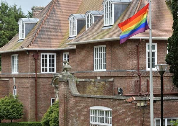 The LGBT rainbow flag flies outside Stormont House in 2017. This year royal pictures were removed from inside the property