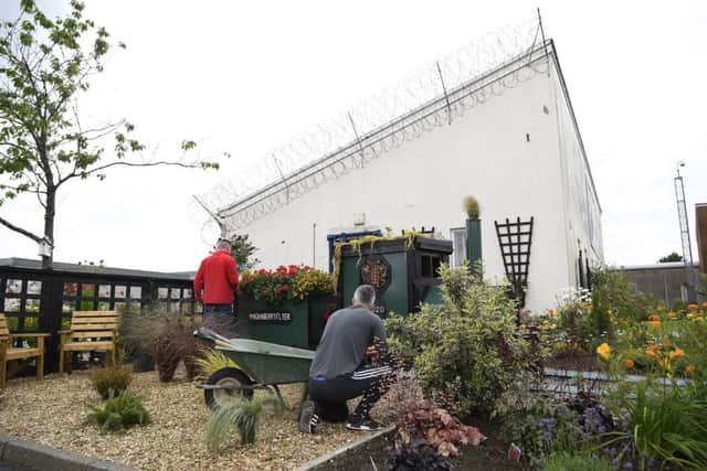 Pictured in the garden at Maghaberry are prisoners at work. Picture: Michael Cooper