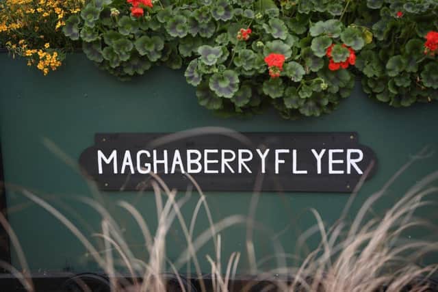 The Maghaberry Flyer - and track, reflecting their journey from incarceration to release. Pictured in the garden at Maghaberry are prisoners at work. Picture: Michael Cooper
