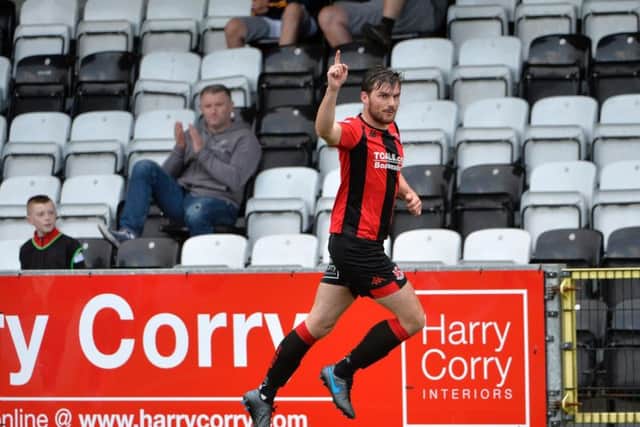 Philip Lowry celebrates finding the net at Seaview on Saturday for Crusaders against Dungannon Swifts.