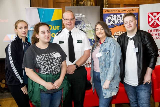 PSNI chief constable Simon Byrne with participants from Northern Ireland Alternatives and Inside Youth, after speaking at the Patten 20 Years On: Young People, Policing and Stop and Search conference, in the Great Hall of Queen's University Belfast. PRESS ASSOCIATION Photo. Picture date: Wednesday September 4, 2019. Photo: Liam McBurney/PA Wire