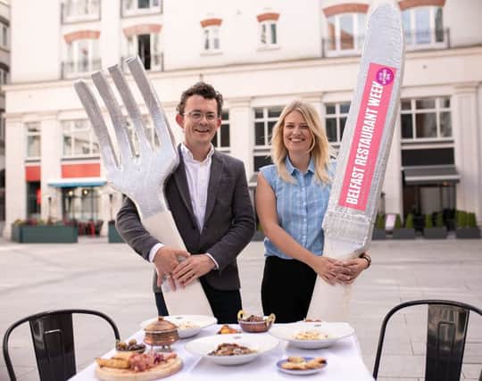 Gareth Neill of Destination CQ and Julie McCullagh of Belfast One celebrate the return of Belfast Restaurant Week in 40 restaurants across the City Centre from 23 to 29 September