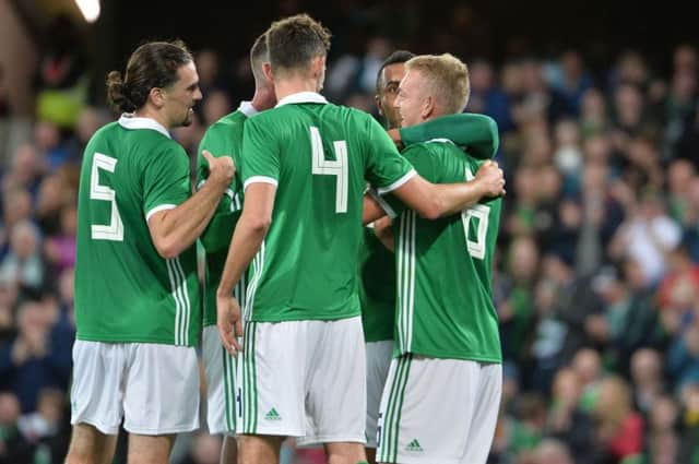 Northern Ireland players celebrate after an own goal by Luxembourg's Kevin Malget during Thursday evening's game at  the National Football Stadium at Windsor Park. Pic Colm Lenaghan/Pacemaker