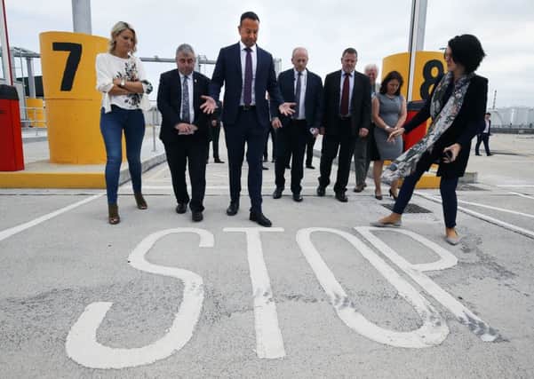Ireland's Taoiseach Leo Varadkar (third left) and European Affairs Minister Helen McEntee (left) with port and customs officials during a visit to new physical infrastructure at Dublin Port which has been put in place to meet the requirements for customs, SPS and health checks on consignments of goods imported from or transiting the UK. Photo: Brian Lawless/PA Wire