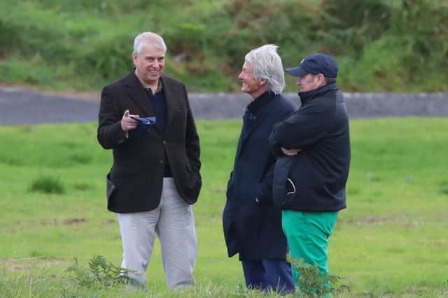 The Duke of York with solicitor Paul Tweed (centre) as he attends The Duke of York Young Champions Trophy at the Royal Portrush Golf Club in County Antrim.
