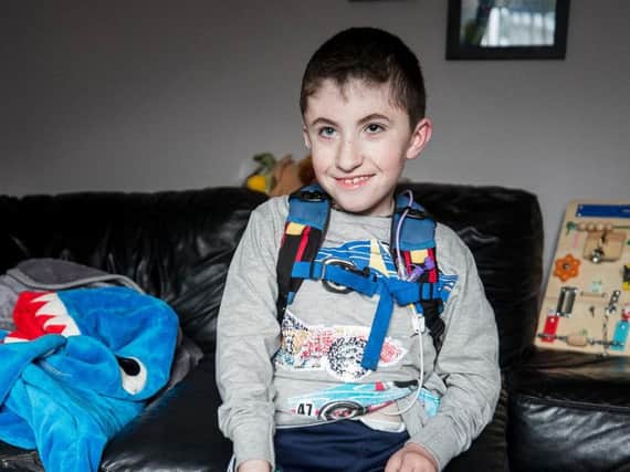 Jack McCrystal who has a neuro-muscular disorder which means he is fed through a tube and uses a wheelchair, at home in Draperstown in Co Londonderry