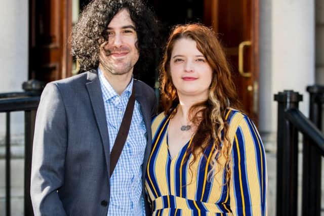 Emma DeSouza and Jake DeSouza outside the Royal Courts of Justice in Belfast. A tribunal has heard that people born in Northern Ireland are British citizens, unless they renounce that citizenship. (Photo: P.A. Wire/Liam McBurney)