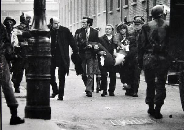 Father Edward Daly and others try to get medical aid for one of those shot by the Parachute Regiment on Bloody Sunday. 
Stanley Matchett