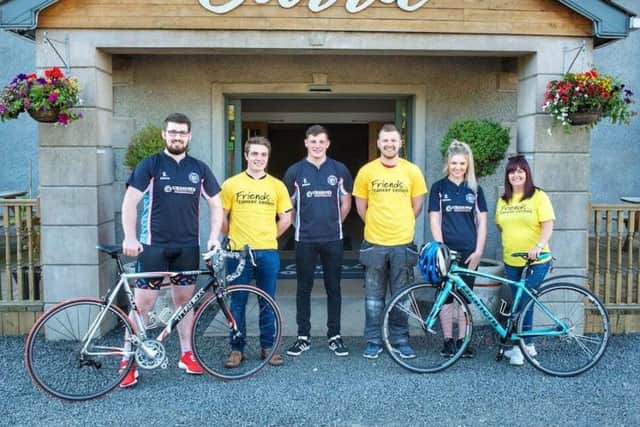 Club members from left to right Houston Bonnar, Andrew White, James Fullerton, Peter McWhirter, and Sarah Davidson, getting support before the big cycle from the community