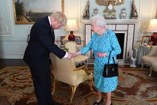 Boris Johnson with the Queen in Buckingham Palace on the day he officially became prime minister at the end of July.
