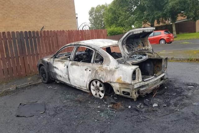 The burnt out car at Pinebank, Craigavon.
