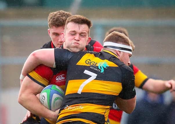Lansdowne's David O'Connor is tackled by Conor Mitchell of Young Munster
.