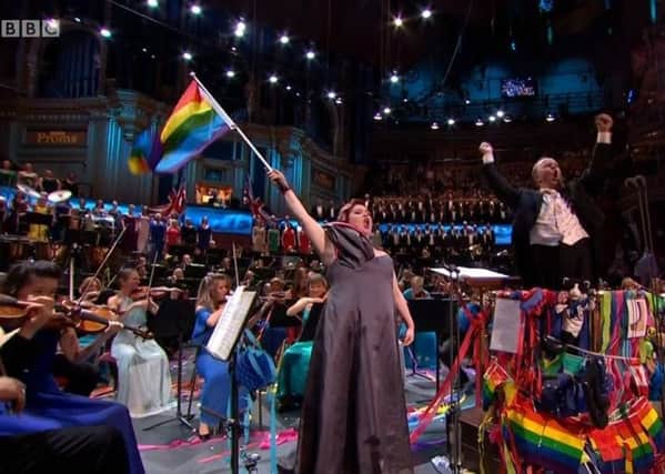 Jamie Barton, the bisexual American mezzo-soprano waves an LGBT rainbow flag during the annual rendition of Rule Britannia at Last Night of the Proms at the Royal Albert Hall, Saturday September 14 2019. Some people like to lampoon the nationalist spirit of Last Night in various good humoured ways, but in Northern Ireland Proms In The Park audiences don't even get the chance, with much of the nationalist good fun edited out, in an event that has almost no relationship to Last Night. Screengrab from BBC One