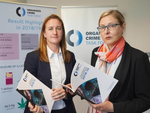 Handout photo issued by Aaron McCracken Photography of Director of Safer Communities at the Department of Justice Claire Archibold (right) and DS Rachel Shields of the PSNI at the launch of the Organised Crime Task Force (OCTF) Annual Report.
