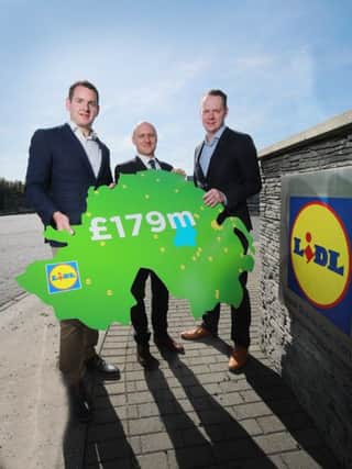 (L-R) JP Scally, Managing Director of Lidl Ireland & Northern Ireland, Neil McCullough, Oxford Economics, and Conor Boyle, Lidl Northern Ireland Regional Director. Pic by Phil Smyth Photo.