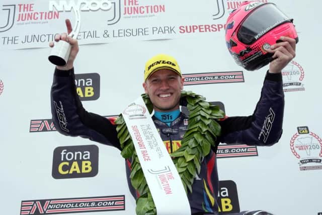 English rider Davey Todd celebrates his maiden international road racing win at the North West 200 in the Supersport class in May.