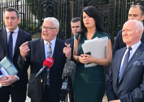 Francis McGuigan (second left) outside of the High Court in Belfast on Friday September 20 2019, where he welcomed a ruling by the Court of Appeal in Belfast that 14 internees, known as the Hooded Men, had a legitimate expectation of a PSNI investigation into their treatment. Photo: Rebecca Black/PA Wire