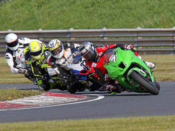 Graeme Irwin leads Carl Phillips, Alistair Kirk and Gerard Kinghan in the Superbike class at Bishopscourt. Picture: Derek Wilson/Pacemaker Press.
