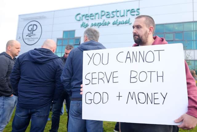 Protests outside Green Pastures Church in Ballymena by former Wrightbus employees.  The bus manufacturing business shut last week after a deal with a buyer fell through with the loss of 1,400 jobs.  The church is closely associated with the factory and its owners and sits on the same land.   Picture by Jonathan Porter/PressEye