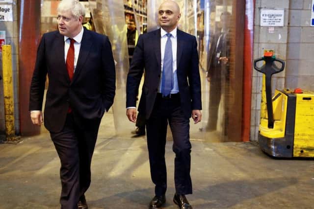 Prime Minister Boris Johnson (left) and the Chancellor of the Exchequer Sajid Javid during a visit to Bestway Wholesale in Manchester today. Photo: Henry Nicholls/PA Wire