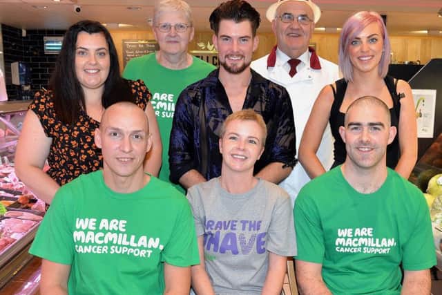 Pictured after the charity head shaving event at Knox's Foodcourt are back row from left, Ruth McCoo, stylist, Daphne Kilpatrick, Macmillan Cancer Support area fundraiser, Chris Kirk, stylist, Barry Knox and Alex Potts, stylist. Front from left, Fergie Strolia, Vivien Wilson and Adrian Knox. INPT40-205.