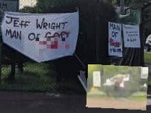Some of the slogans erected near the Wrightbus factory in Ballymena at the weekend. Inset: an unidentified man removes all of the slogans by ripping them free.