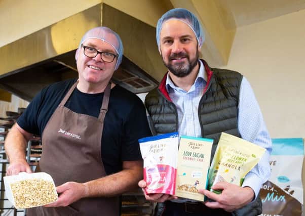 Gareth McAnlis, Fresh Foods Development Manager at Henderson Wholesale is pictured with David Crawford, co-founder of Just Live a Little, one of the 13 local artisanal food producers to be added to Hendersonâ¬"s local supplier roster as part of a long-term business strategy.