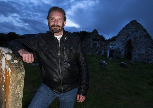 Paranormal investigator Stephen McKinley at Bonamargy Cemetery in Ballycastle