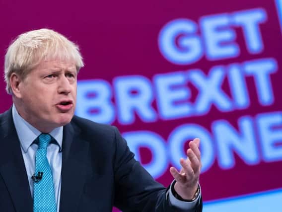 Prime Minister Boris Johnson on stage giving his speech at the Conservative Party Conference at the Manchester Convention Centre. (Photo: Danny Lawson/PA Wire)